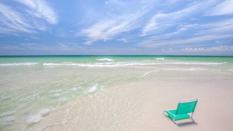 Beach chair in the clear water of Destin