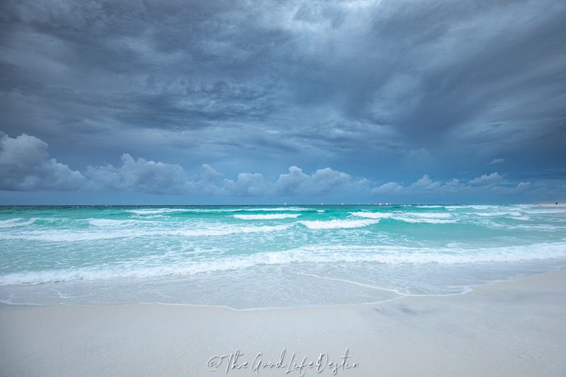 Storm Clouds over the crystal clear water of miramar beach