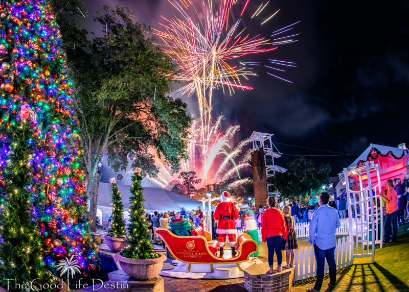 Santa watching Fireworks at Baytowne Wharf showing that Winter is the best time to visit Destin for Christmas and holiday events
