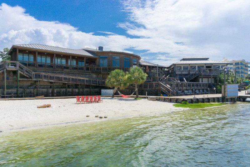 Beach area for paddle boards and kayaks at Boshamps in Destin