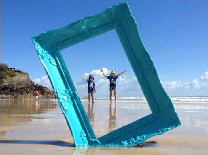 Picture frame framing kids on the beach in Destin