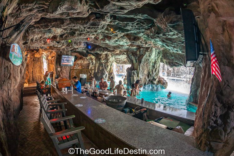 Swimmers at the bar of the Island swim up pool bar