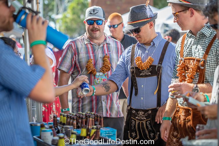 People dressed in costume and drinking beer at Baytowne Wharf Beer Fest