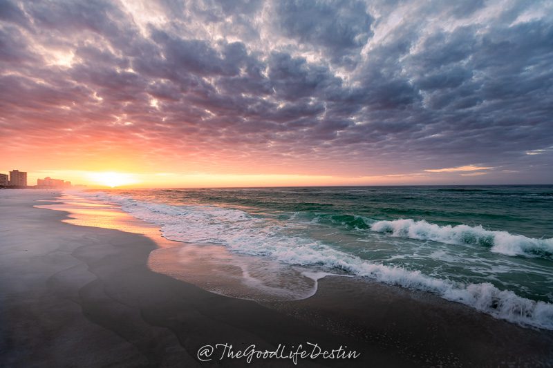 the sun rising over the beach in Destin Florida in March