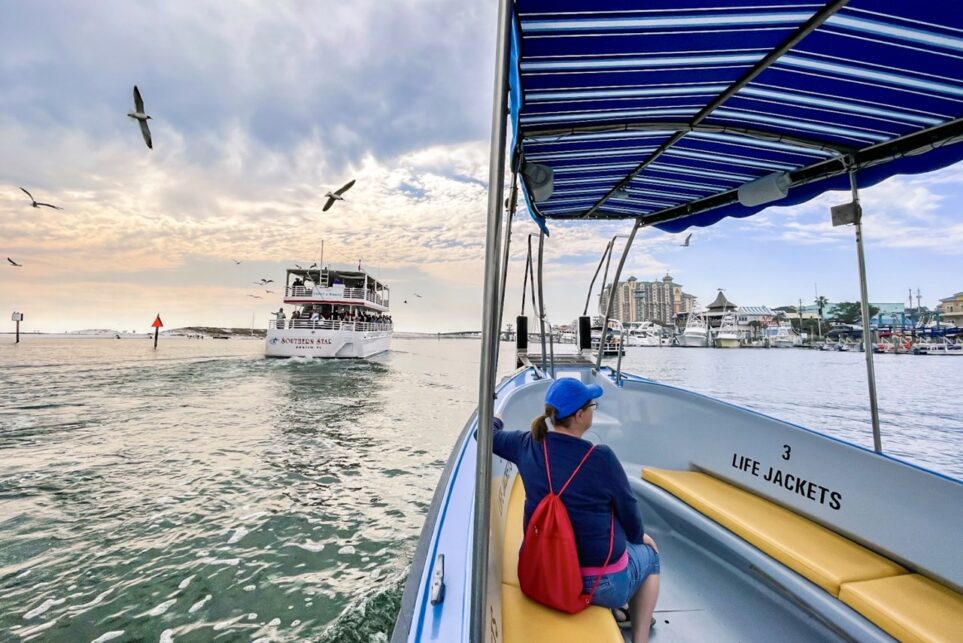 Women onboard the Destin Water Taxi as the Southern Star dolphin cruise passes 