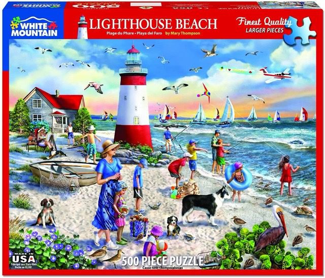People on a beach near a lighthouse on a sunny day puzzle