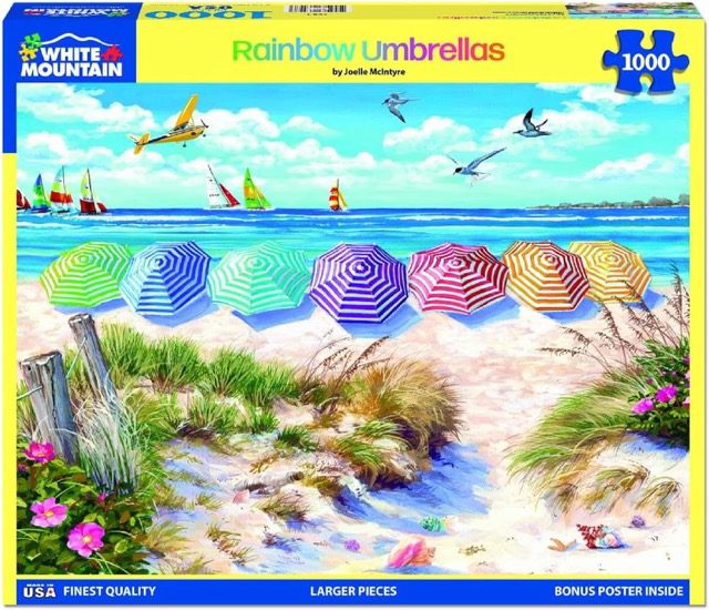 A puzzle with colorful rainbow striped umbrellas at the beach