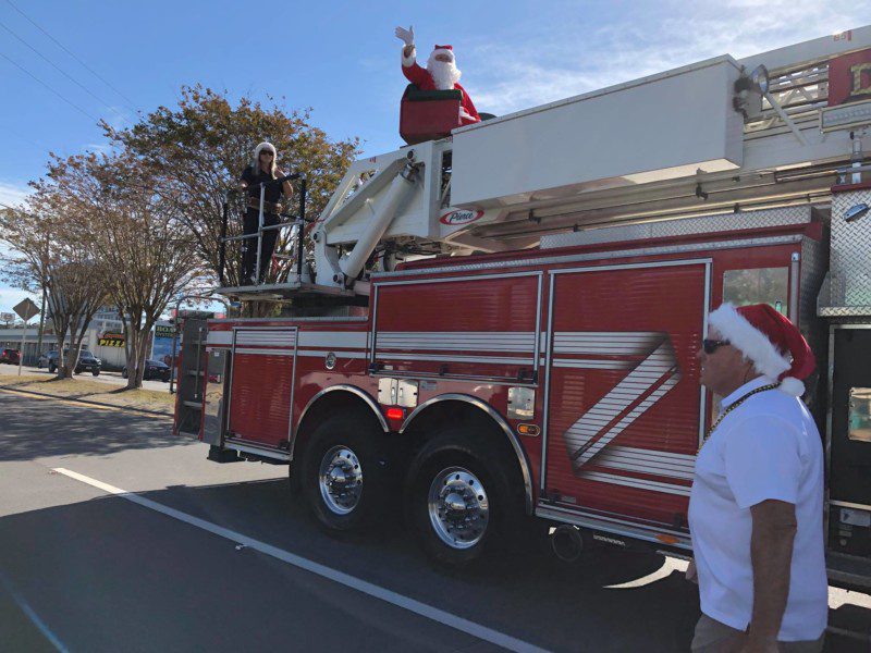 Santa waving from a Fire Truck in the Destin Christmas parade
