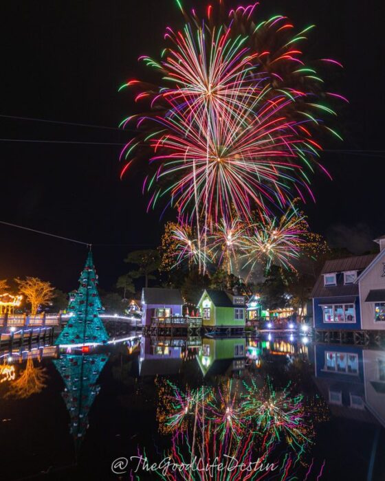 Fireworks over the lagoon with a Christmas tree at Baytowne Wharf Sandestin
