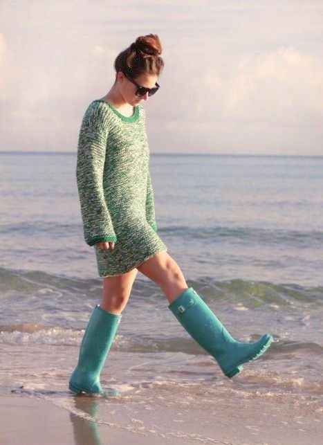 Girl walking on the beach in Destin in Rain Boots at Christmas