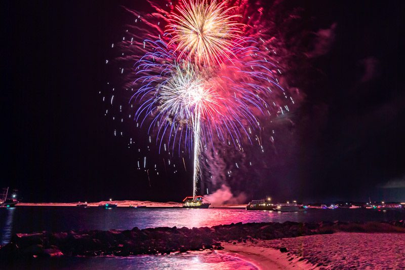 Fireworks exploding over Norriego Point Beach in Destin