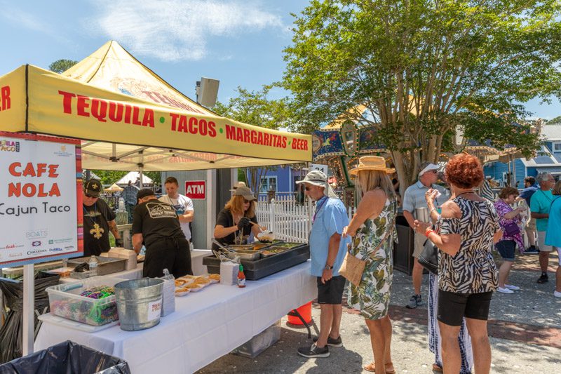 People eating tacos and tasting Tequila at Baytowne Wharf