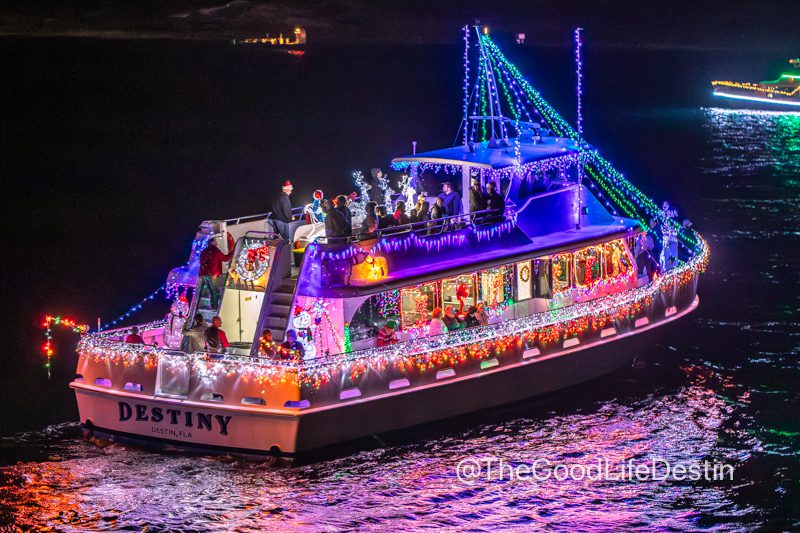 Destin charter boat decorated for the lighted boat parade on Destin Harbor