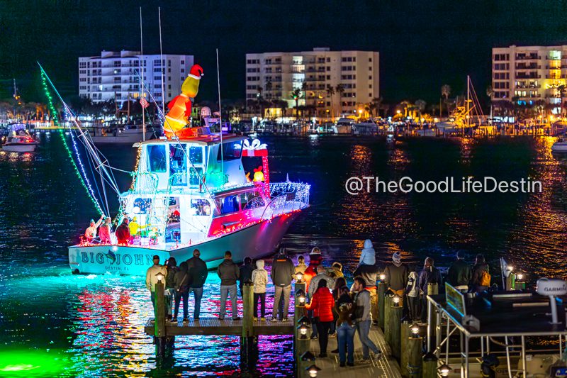 People watching the boats in the Destin Harbor Christmas parage