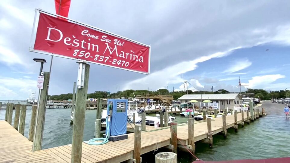 The Destin Marina sign on the boat docks of Choctawhatchee Bay