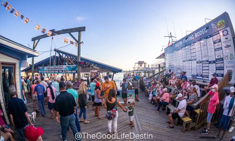 People gathered around the weigh-in docks at AJ's in Destin Florida watching the weigh-ins for the Destin Fishing Rodeo