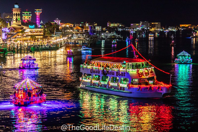 Boats on Destin Harbor decorated with Christmas lights for the Lighted boat parade