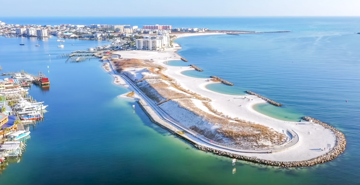 Aerial view of Norriego Point in Destin, Florida showing the completed park, boardwalk, swimming coves, and surrounding harbor and Gulf waters in 2026