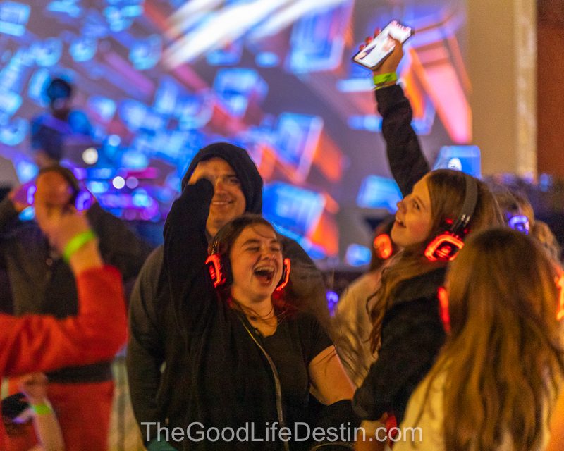 Familes and friends enjoying dancing with silent disco headphones at Harborwalk Village