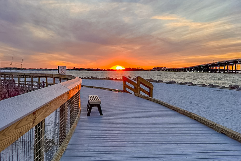Sunset over the water at Norriego Point Beach Park in Destin Florida 